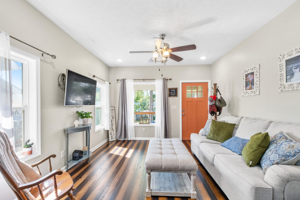 Modern living room with open front window