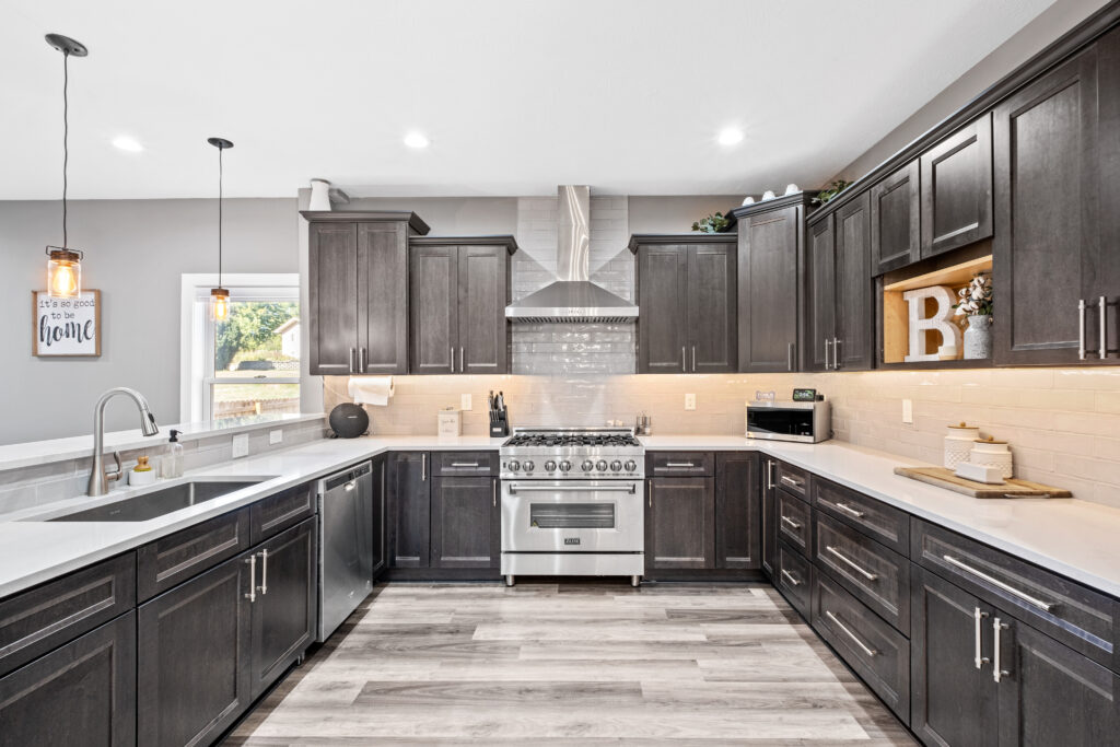 Black and white kitchen with silver appliances