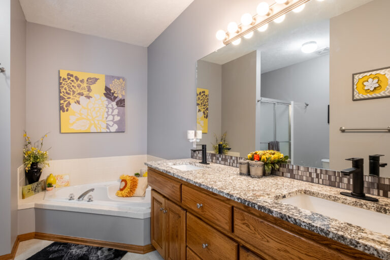 Bathroom with yellow flower designs throughout.