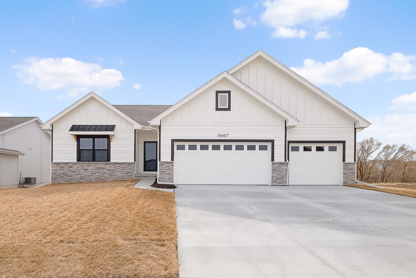 White home exterior, lawn, and driveway